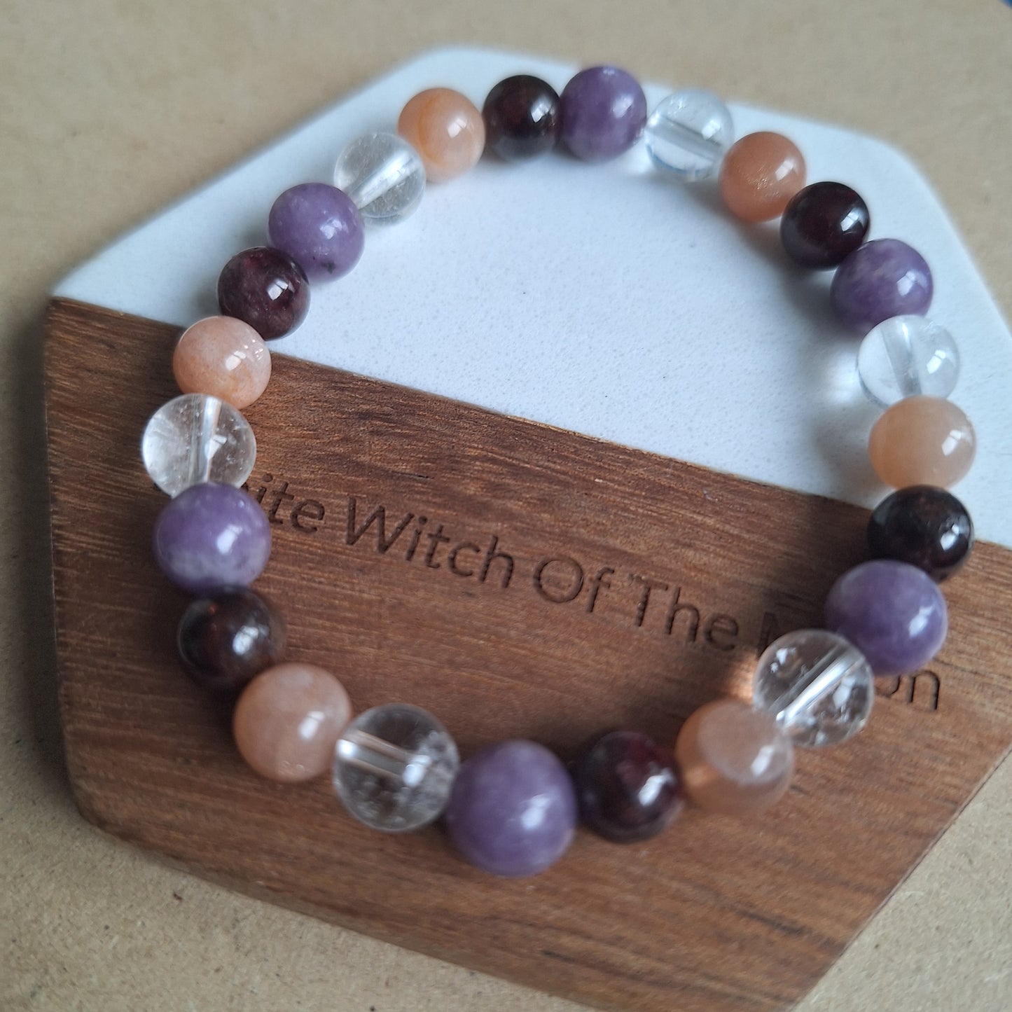 Menopause bracelet moonstone Garnet clear quartz and.lepidolite