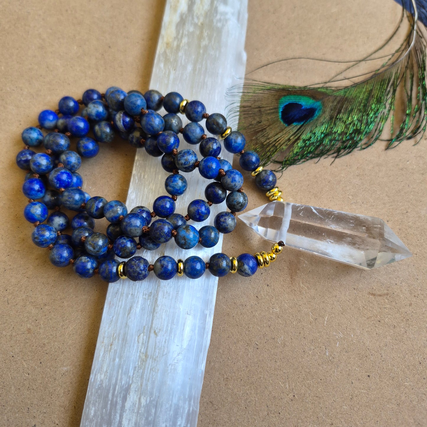 Lapis Lazuli knotted necklace with double terminated clear quartz Point