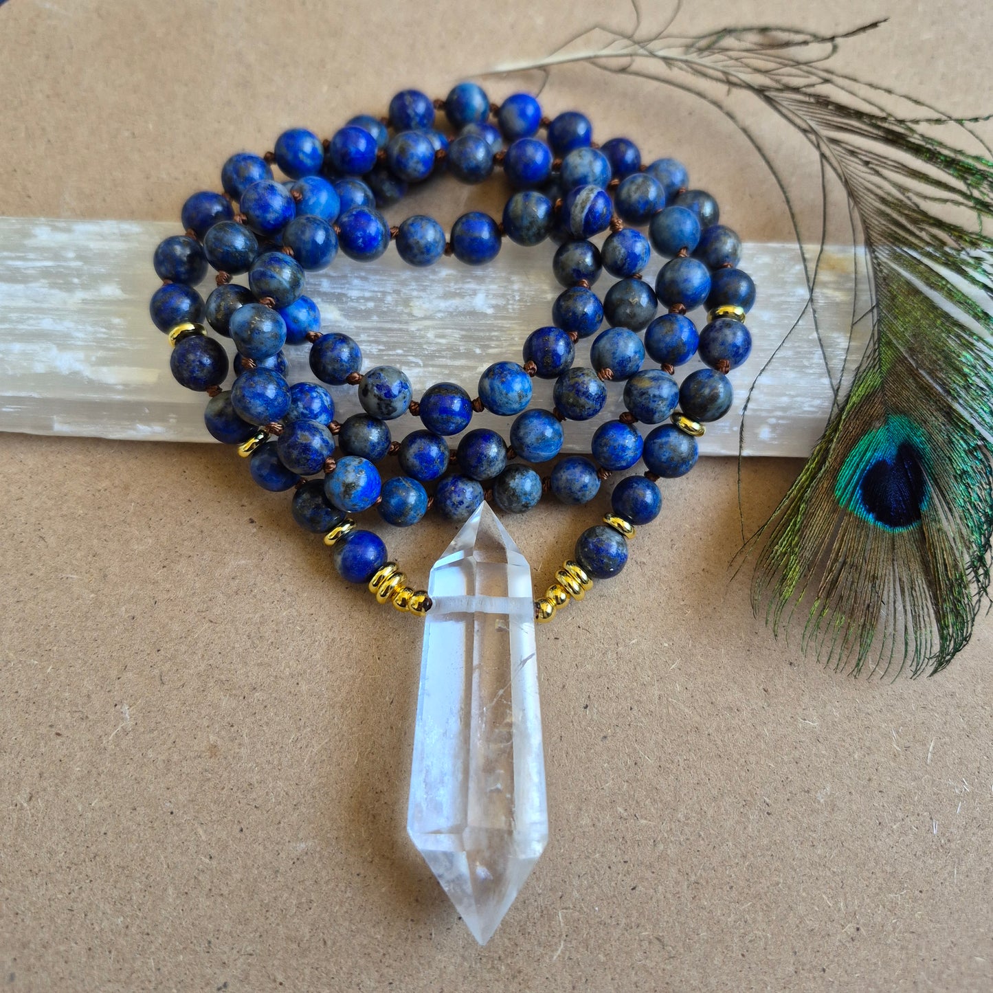 Lapis Lazuli knotted necklace with double terminated clear quartz Point