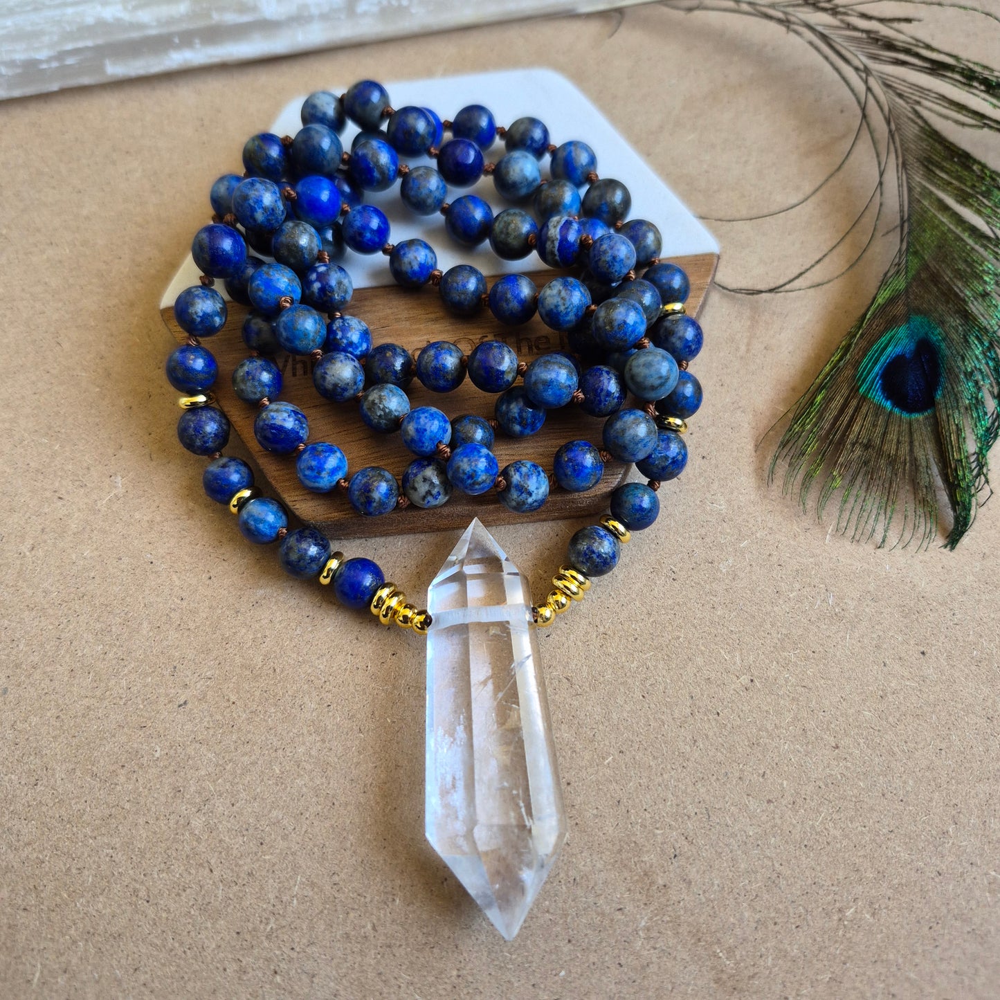 Lapis Lazuli knotted necklace with double terminated clear quartz Point