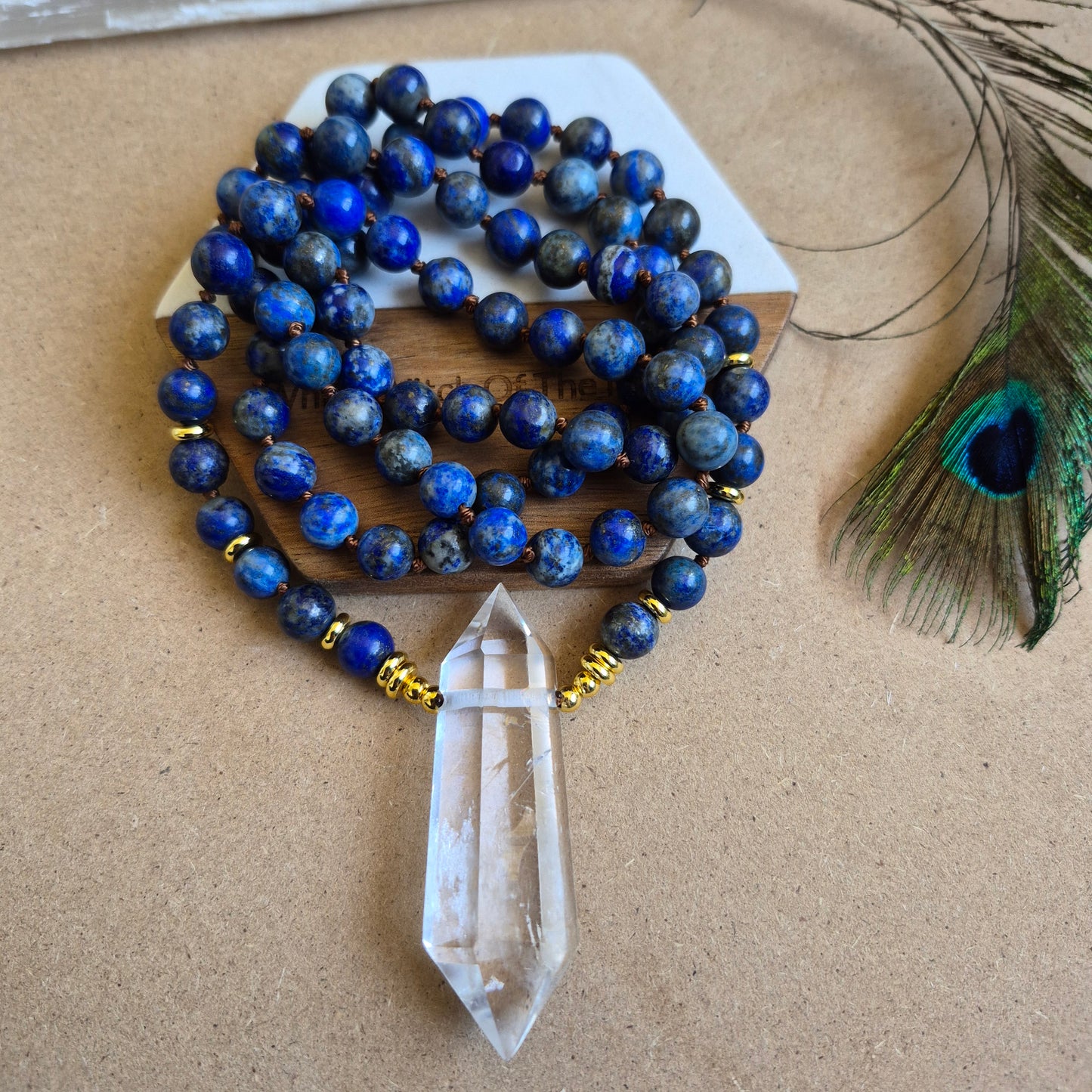 Lapis Lazuli knotted necklace with double terminated clear quartz Point