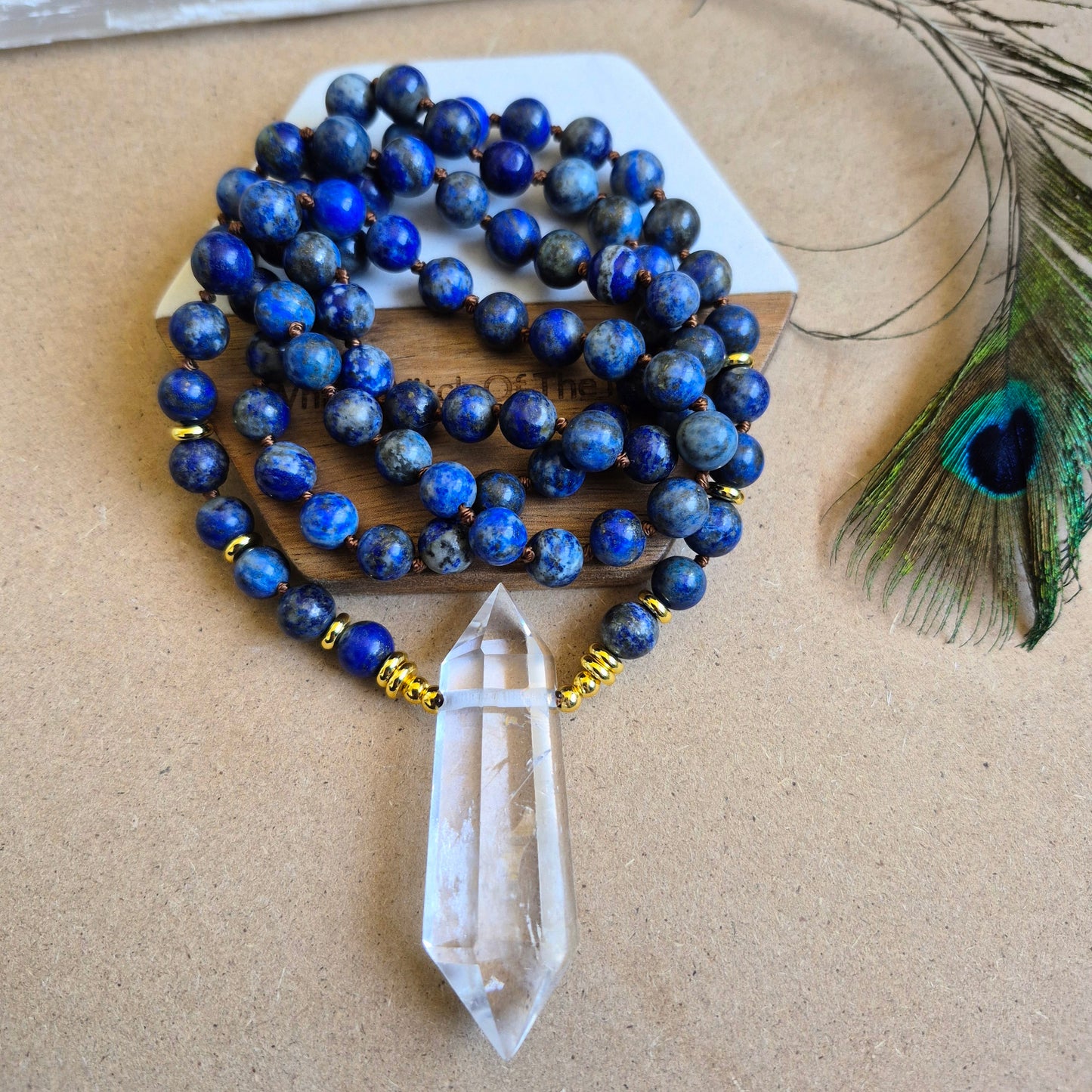 Lapis Lazuli knotted necklace with double terminated clear quartz Point