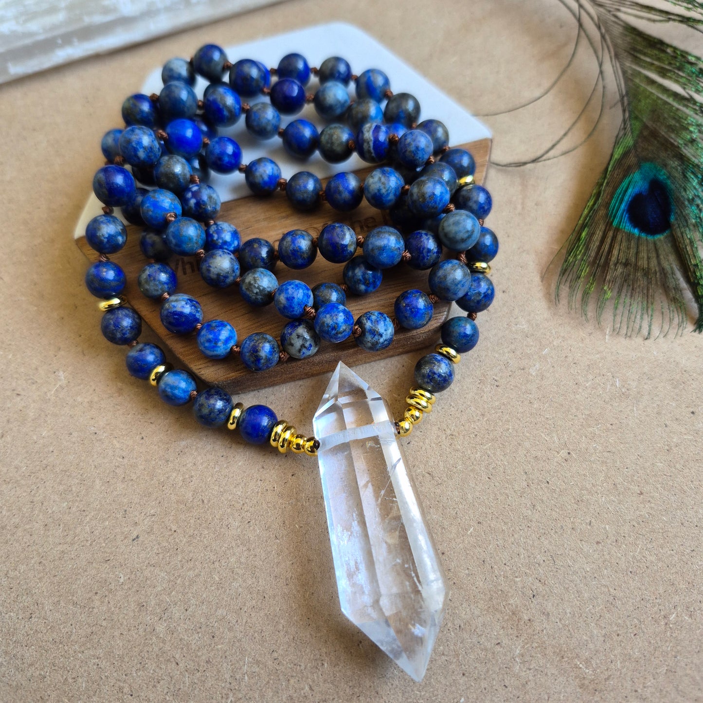 Lapis Lazuli knotted necklace with double terminated clear quartz Point