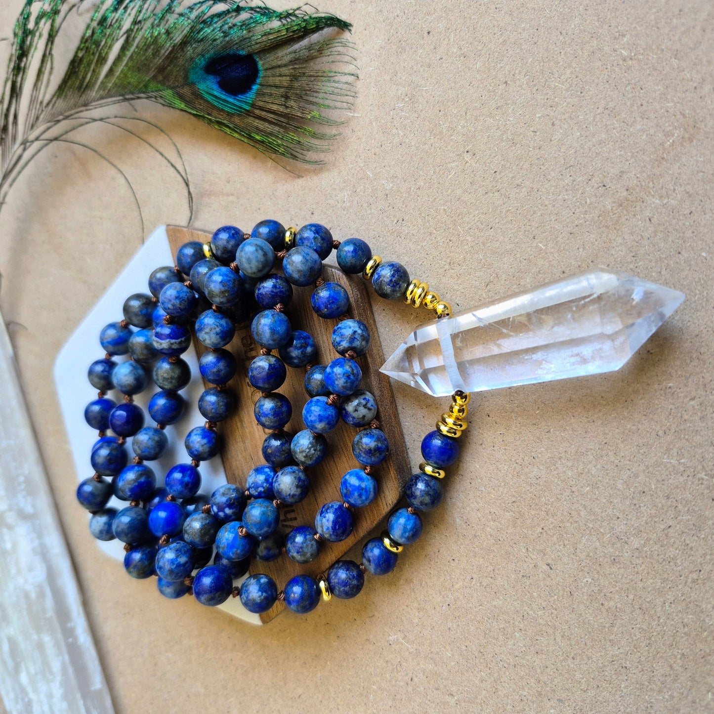 Lapis Lazuli knotted necklace with double terminated clear quartz Point