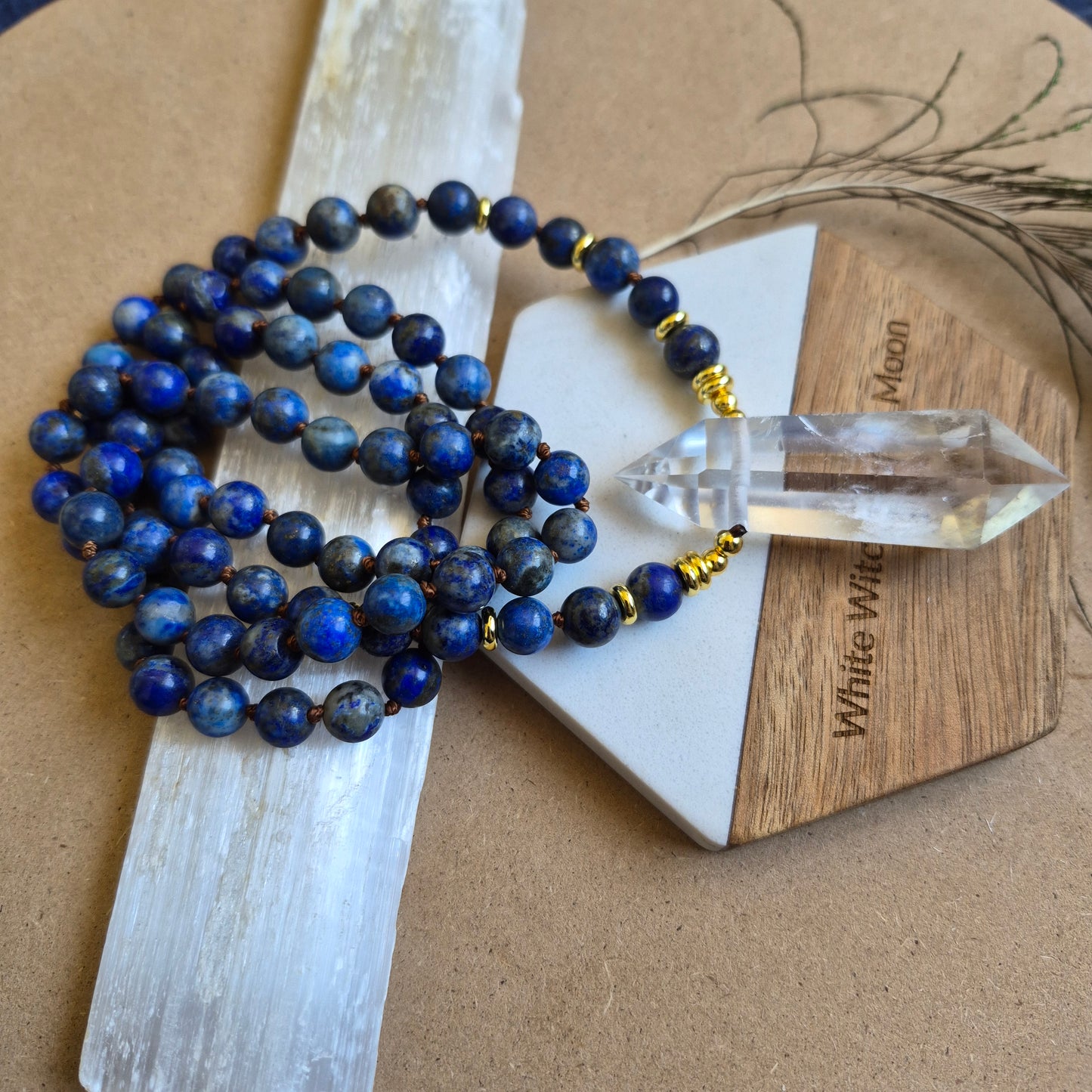 Lapis Lazuli knotted necklace with double terminated clear quartz Point